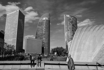 Modern buildings in city against sky