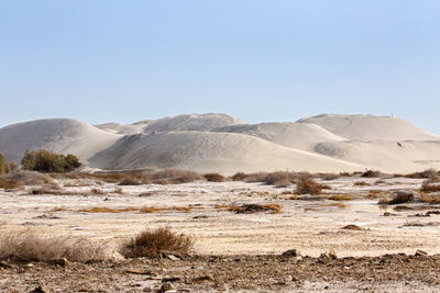 Scenic view of desert against clear sky