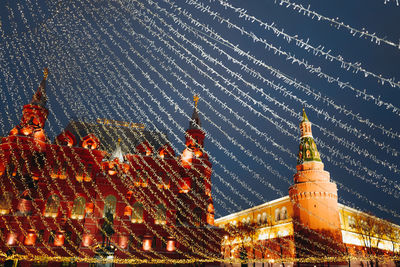 Christmas tree in red square moscow decorated with golden balls and garlands, twinkling lights. 