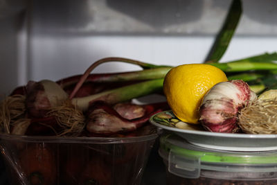 Close-up of fruits in basket on table