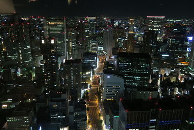 High angle view of illuminated buildings in city at night