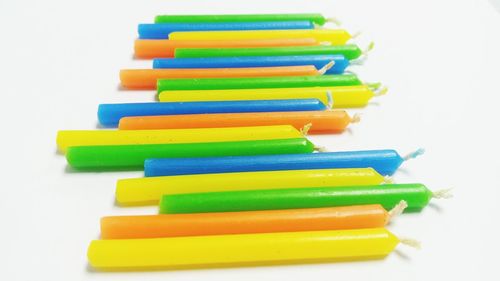 Close-up of multi colored pencils on white background