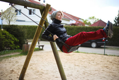 Side view of young woman relaxing outdoors