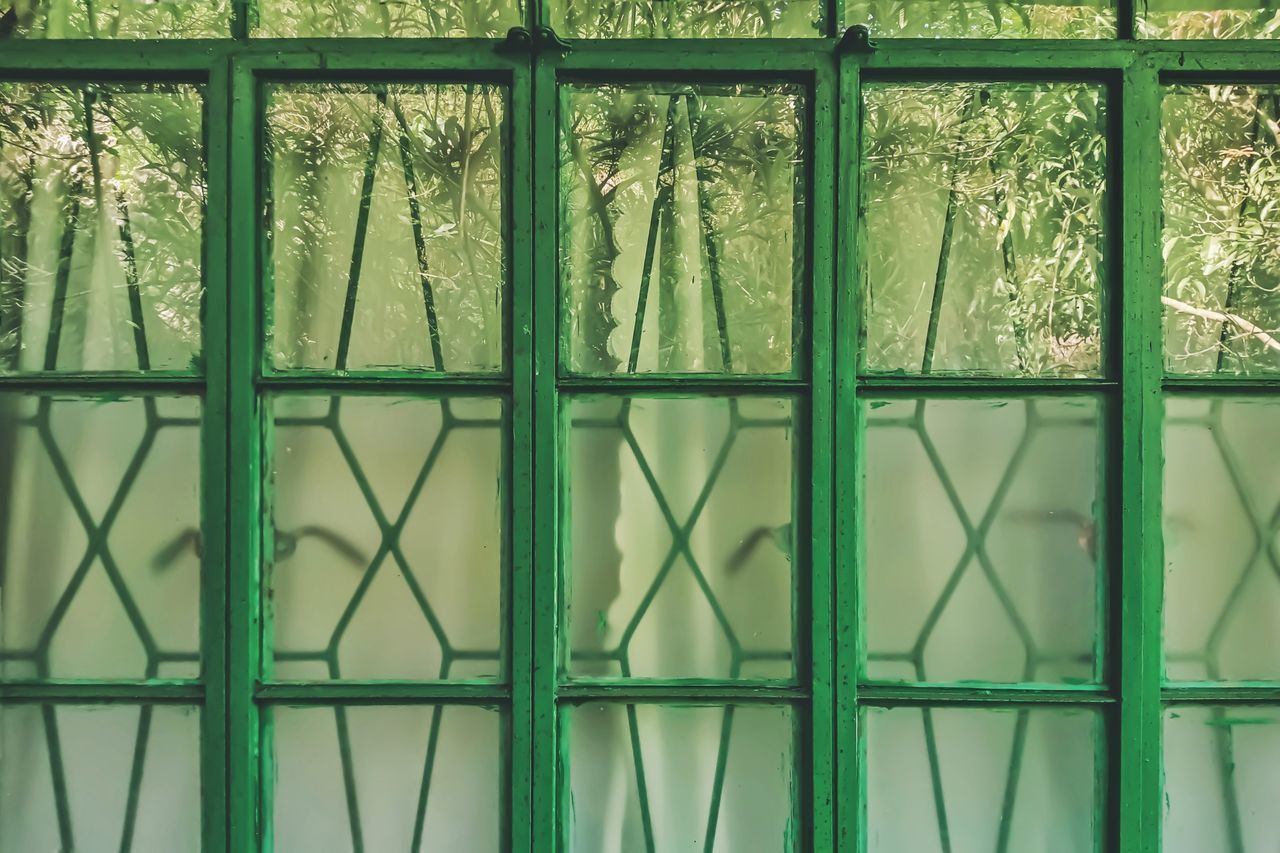 FULL FRAME SHOT OF WINDOW WITH METAL GRATE