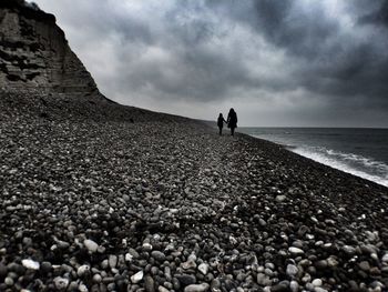 Scenic view of sea against cloudy sky