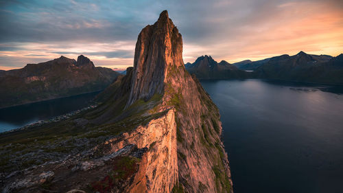 Panoramic view of lake and mountains against sky during sunset