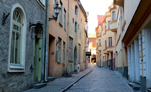 Narrow alley amidst buildings in town