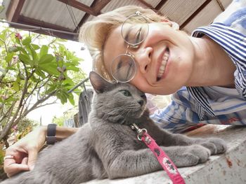 Midsection of woman with cat