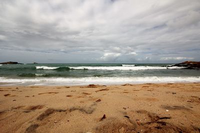 Scenic view of beach against sky