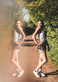 Digital composite image of young woman reflecting in glass while posing on footpath