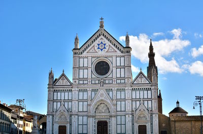 Low angle view of building against blue sky