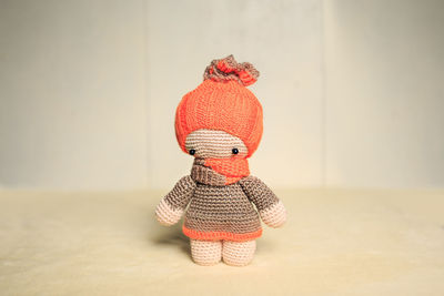 Red toy against wall