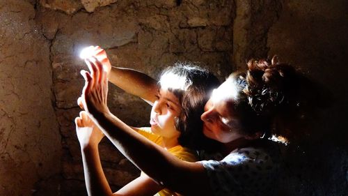 People in illuminated traditional clothing