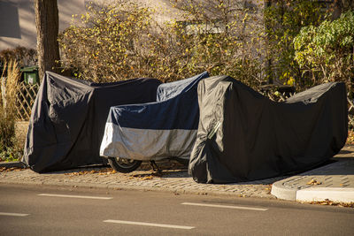 View of tent on road against trees in city