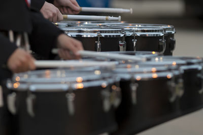 Two snare drummers warming up before the bands performance at a football game