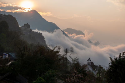 Scenic view of mountains against sky during sunset