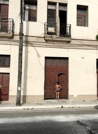 Woman on window in city