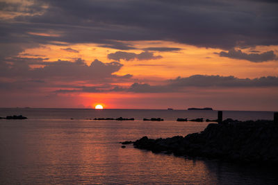 Scenic view of sea against sky during sunset