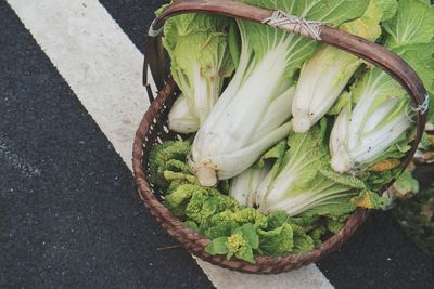 High angle view of vegetables in basket on road