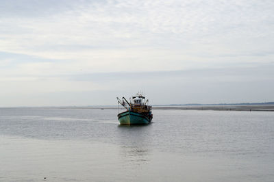 Boat in sea against sky