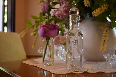 Close-up of flower vase on table at home