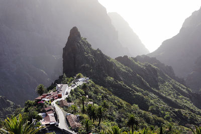 High angle view of village and mountains