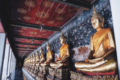 Low angle view of buddha statue in temple