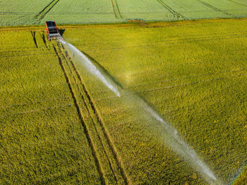 Aerial view of irrigation with sprinkler in agriculture