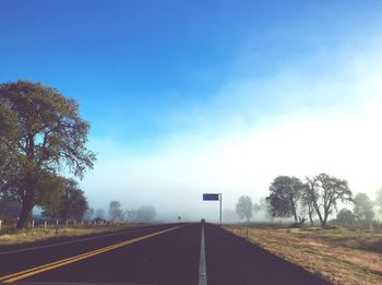 Empty road against sky