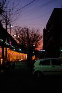Road with buildings in background at dusk