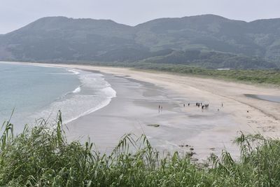 High angle view of beach against mountains