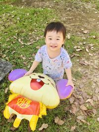 Portrait of cute boy on field