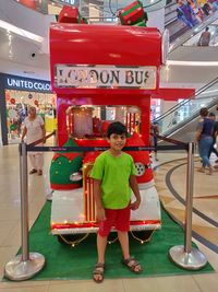 Portrait of boy standing with text
