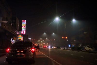 Cars moving on road at night