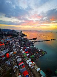 High angle view of buildings against sky during sunset