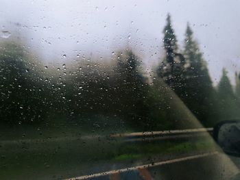 Raindrops on glass window of rainy season