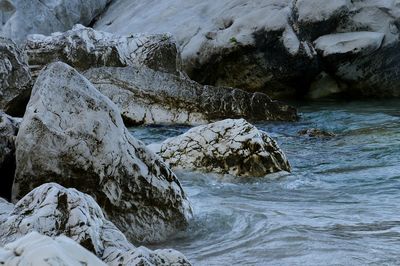 Scenic view of rocks in sea during winter