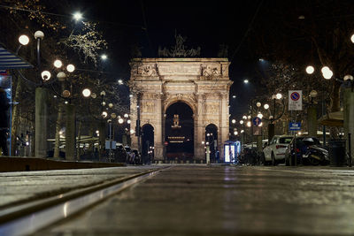 View of illuminated street at night