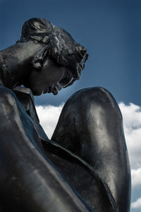 Low angle view of statue against sky