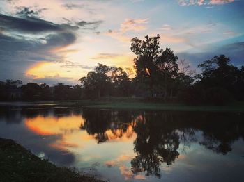 Scenic view of calm lake at sunset