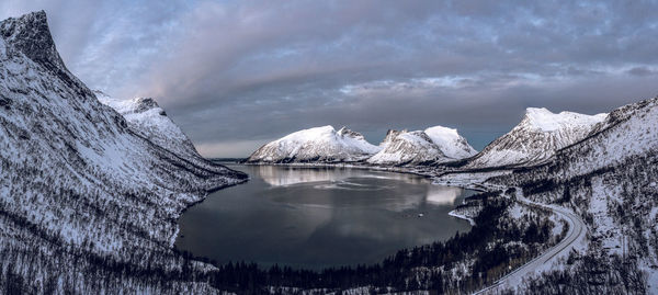 Scenic view of fiord against sky during winter