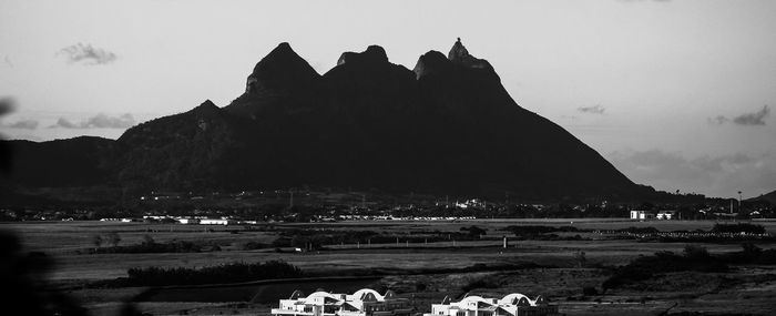 Panoramic view of people on mountain against sky