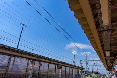 Low angle view of railroad tracks against sky