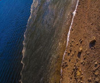 High angle view of waves on beach