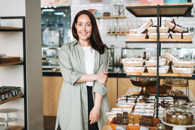 Adult business woman forty years with long hair in stylish shirt in cafe