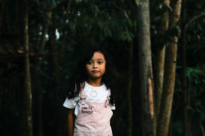 Portrait of a little girl in forest