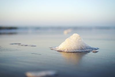 Surface level of frozen sea against sky