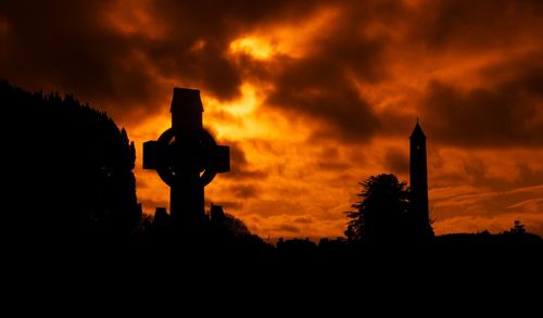 Silhouette tombstone at glasnevin cemetery during sunset