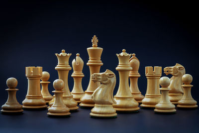 Close-up of chess pieces against white background