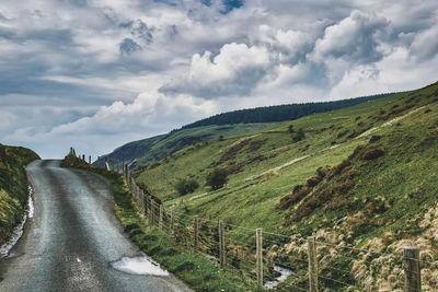 Wales countryside with road leading into the hills.